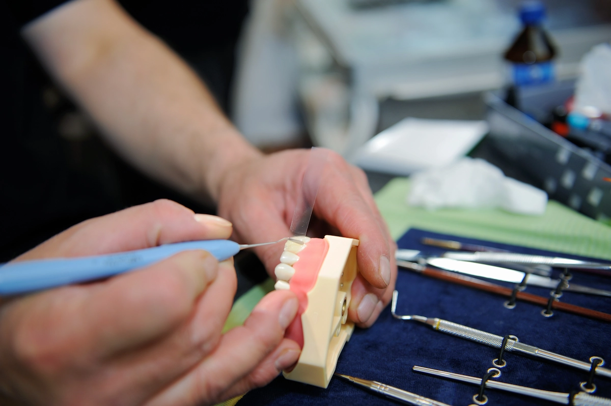 dental-technician-manifacturing-medical-tooth-prosthetic-laboratory